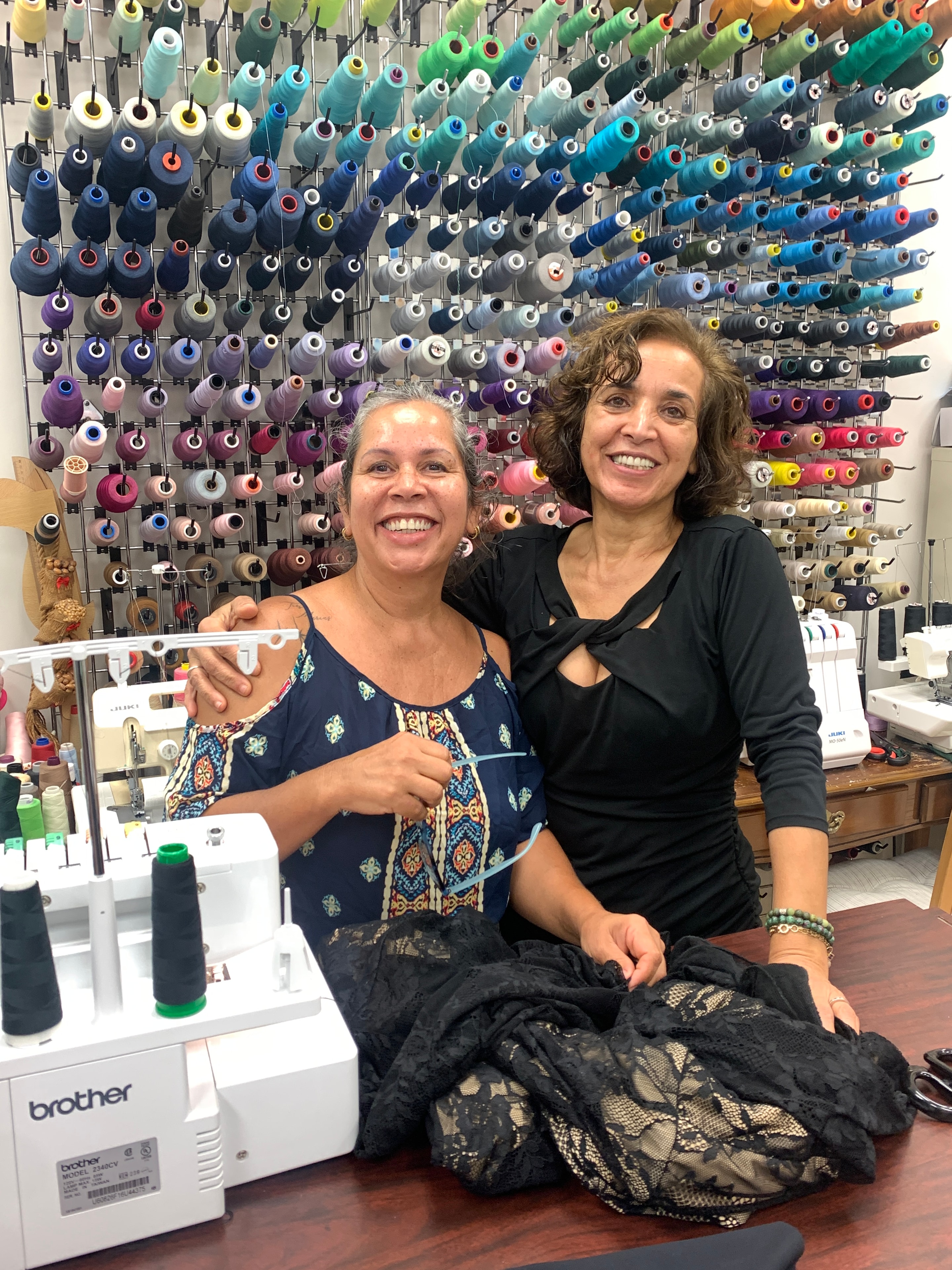 Team in front of thread wall